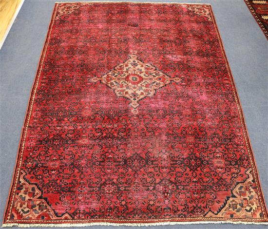 A Hamadan red ground rug, 7ft 11in by 4ft 11in.